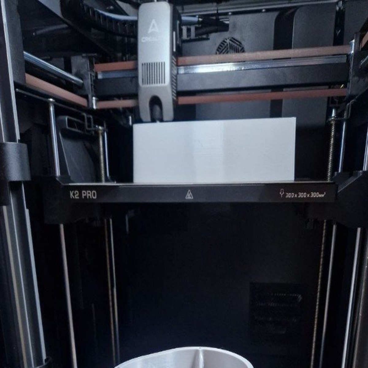 K2 Pro — active print job inside enclosed build chamber